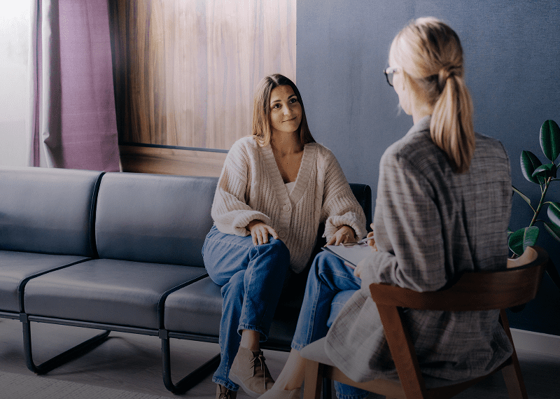 Women sitting and talking indoors
